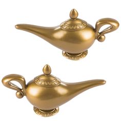 two golden teapots sitting on top of each other