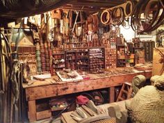 a room filled with lots of different types of items on top of wooden shelves next to each other