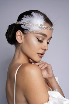 Amazing flapper Headpiece is rhinestone headband with white feather is a gorgeous accessory for your special occasions such as photo shoots, Great Gatsby Wedding or party, Engagement, Birthdays, graduation, Bridal shower or for you to dress up on any ordinary day! All beads are individually sawed in by me with love and care! Regulated by ribbon Can be tied around the neck and head READY TO SHIP. * All items are gift boxed and your order will be carefully packed in branded box, so that the product is fixed in the box and not bruised. ------------------------------ ✅Real colours may slightly different from one monitor to another,as it depends on. Specific monitor settings. ✅The products will be shipped by courier company and the trucking number will be sent to the customers. ✅Created in a pe White Gatsby Outfit, Flapper Dress Headband, Great Gatsby Hair Piece, Feather Headpiece Wedding, 1920s Feather Headpiece, Great Gatsby Headpiece Diy, Gatsby Headpiece Diy, Great Gatsby Party Hairstyles, White Feather Headpiece