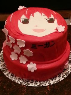 a red cake with white flowers on it