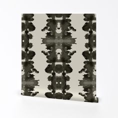 an abstract black and white pattern on a canvas wall art print, mounted to the wall