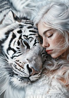 a woman is hugging a white tiger with her face close to it's chest