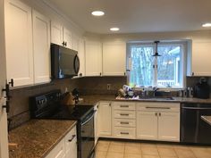 the kitchen is clean and ready for us to use it's new appliances in