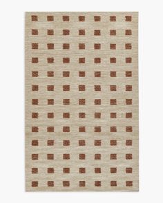 a beige rug with brown squares on the top and bottom, against a white background