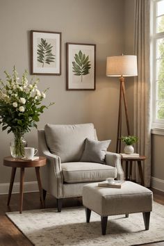 a living room with a chair, ottoman and flowers in vases on the table