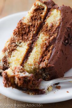 a piece of cake on a plate with a fork next to it and the rest of the cake is missing