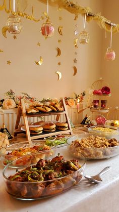 a table filled with lots of food and desserts