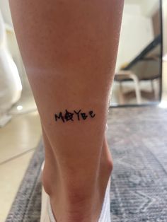 a woman's foot with the word mate written on it in cursive writing