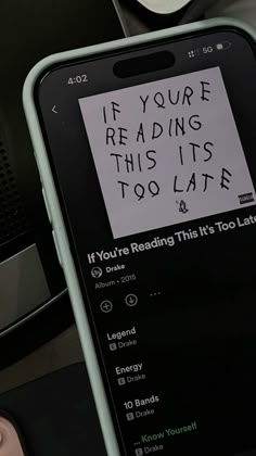 a cell phone with a note attached to it