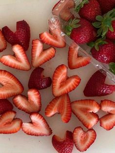 strawberries are arranged in the shape of hearts