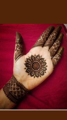 henna tattoo on the palm of someone's hand