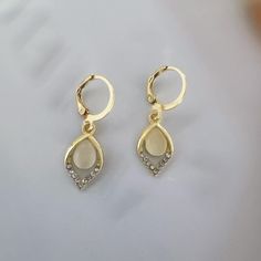 Discover the timeless beauty of our Cat's Eye Stone Teardrop Dangle Drop Earrings for Women. The delicate teardrop shape and cat's eye stones add a touch of elegance and charm to any outfit. Perfect for day or night, these earrings will make you feel confident and chic. Earrings length 1.2 inches width 0.4 inches. Cats Eye Stone, Chic Earrings, Cats Eye, Eye Stone, Feel Confident, Earrings For Women, Timeless Beauty, Cat Eye, Favorite Jewelry