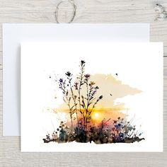 a card with watercolor flowers on it