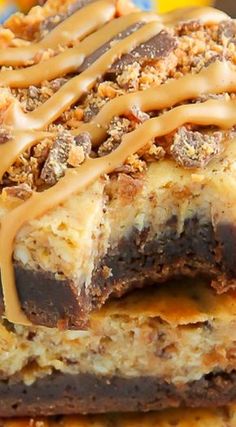 three dessert bars stacked on top of each other with chocolate and caramel drizzle