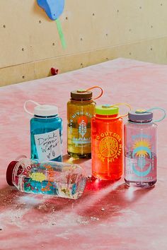 several different types of water bottles on a table