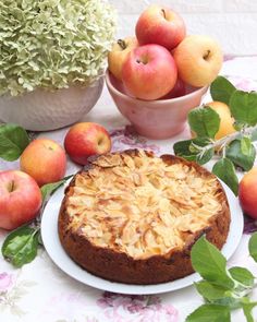 a cake on a plate next to some fruit