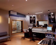 an empty recording studio with sound equipment