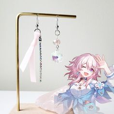 ✧ Introducing our Honkai Star Rail Inspired Earring Collection ✧ ✧ March 7th: Asymmetrical silver earrings with a cute pink ribbon inspired by her in-game earrings. We've added a delicate iridescent rhinestone chain for extra cuteness. On the opposite earring is a crystal snowflake to represent her ice element. This style is so lightweight and cute!!  ✧ All earrings are designed by us and made in-house. These earrings were inspired by the characters themselves and are not made to be exact replicas from the game.  ✧ These earrings are made with those metal allergies in mind. Earring hooks are 316 surgical stainless steel (gold and silver).  ✧ Nickel-free clip-ons available upon request (send us a private message :) ) Single Star-shaped Crystal Earring As Gift, Genshin Accessories, Genshin Impact Earrings, Game Earrings, Kpop Earrings, Ribbon Earrings, Anime Earrings, March 7th, Earrings Star