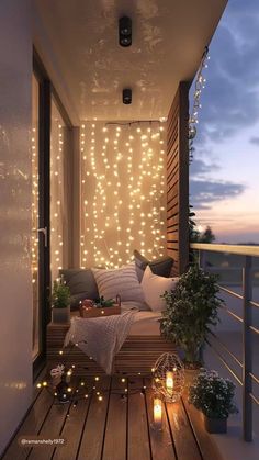 the balcony is decorated with lights and pillows