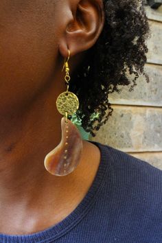 Handcrafted in Nairobi, Kenya. A beautiful, simple pair of earrings to own! Crafted with brass and horn. Length-9.7cm SHIPPING Express shipping (via DHL) takes 2-4 WORKING DAYS to be delivered to you. Metal Hoop Earrings For Gift, Metal Drop Earrings As Gift, Adjustable Chandelier Earrings For Gifts, Brass Pierced Earrings As Gift, Brass Pierced Earrings For Gift, Nickel Free Dangle Earrings As Gift For Her, Pierced Jewelry Gift For Her, Metal Earrings As A Gift, Metal Long Drop Hoop Earrings As Gift