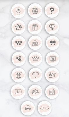 buttons with different icons on them sitting on a marble surface in the shape of a circle