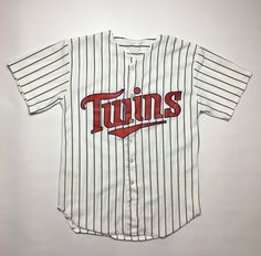 a baseball jersey with the word twins on it