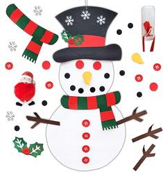 a paper snowman is surrounded by christmas decorations and other crafting supplies on a white background