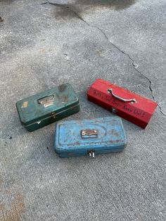 three pieces of luggage sitting on the ground