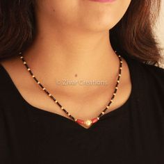 Italian Coral with an 18-inch mangalsutra with gold plating. A simple and delicate mangalsutra chain with a pearl combination for perfect daily use. It looks pretty with traditional and fancy outfits. I have more delicate designs in gold plating and in sterling silver as well. Please go through the mangalsutra section once. I do accept custom designs; kindly message me with your queries. Length - 17 inches Coral Black Beads Jewellery, Black Beads Mangalsutra Design Simple Short, Pearl Mangalsutra Designs, Black Beeds Chain Indian Gold Short, Coral Mangalsutra, Pearl Mangalsutra, Fancy Mangalsutra