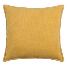 a yellow pillow on a white background