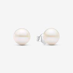 Keep it classic with these Treated Freshwater Cultured Pearl 7mm Stud Earrings in sterling silver. The lustrous 7mm pearls, delicately peg-set, channel timeless elegance. Secured with heart-shaped butterfly backs, this pair is both classic and contemporary. A perfect addition to your earring collection, these pearl stud earrings celebrate the beauty, wisdom, and love symbolized by treated freshwater cultured pearls. Please note each treated freshwater cultured pearl is unique and can vary in size and color; normal wear and tear may occur with this material. Our freshwater cultured pearls are treated with bleaching and lustre enhancement. - Pandora Treated Freshwater Cultured Pearl 7mm Stud Earrings - Sterling silver / Treated freshwater cultured pearl / White White Gold Round Minimalist Pearl Earrings, Timeless Round Pearl Earrings As Gift, Timeless Silver Akoya Pearl Earrings, Classic Round Akoya Pearl Earrings, Classic Silver Akoya Pearl Jewelry, Formal Sterling Silver Pearl White Earrings, Minimalist White Gold Pearl Earrings, Timeless White Gold Pearl Earrings For Gift, Formal Pearl White Sterling Silver Earrings