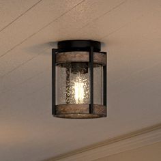 an outdoor light hanging from the ceiling