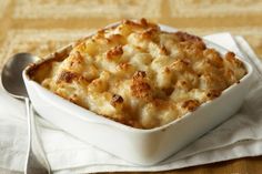 a casserole dish with macaroni and cheese in it on a napkin