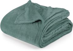 a green blanket folded on top of each other