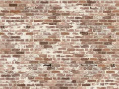 an old brick wall is shown in brown and white