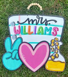 a sign that says mr and mrs williams with some decorations around it on the grass