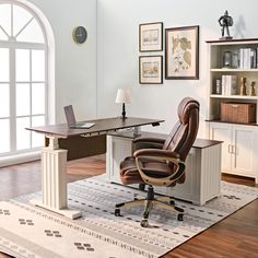 an office area with a desk, chair and bookshelf