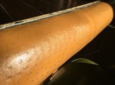 a close up view of an old leather seat