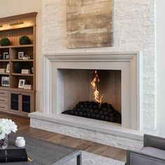 a living room filled with furniture and a fire place