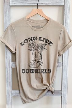 LONG LIVE COWGIRLS GRAPHIC TEE     Our Shirts are Authentically Designed and Hand Screen Printed for Best Quality    *Process where the ink is dyed into the shirt and graphic will not peel away     -Proudly Hand Pressed in Los Angeles, CA.     -30 Singles. 100% Washed Cotton     -Comfortable and Very Soft    -Style by Rolling up the Sleeves, Tie a Side Knot, Front Tuck...       SIZE AND FIT      *Please refer to the last photo option for measurements    WASHING AND CARE    -Machine Wash with Lik Los Angeles, Country Girl T Shirts, Tshirt Trends 2024 Women, Cute Tshirt Designs Graphic Tees Cricut, Cute Cowgirl Shirts, Cute Western Graphic Tees, Cowgirl Shirts Vinyl, Country Shirts Vinyl, Cowgirl Shirt Ideas