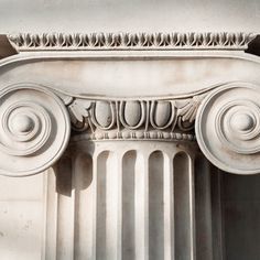 an old column with decorative designs on it