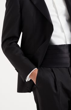 The cotton and silk satin employs the same fabric that decorates the tuxedo lapels, with a smooth texture and slightly shiny effect. Adjustable slide fastening Classic Satin Suits For Semi-formal Occasions, Classic Tailored Satin Suits, Classic Satin Business Suit, Classic Fitted Satin Suit, Silk Fitted Tuxedo With Hidden Button Closure, Satin Tuxedo With Notch Lapel For Formal Events, Fitted Silk Tuxedo For Business, Tailored Satin Tuxedo For Business, Classic Satin Tuxedo For Formal Occasions