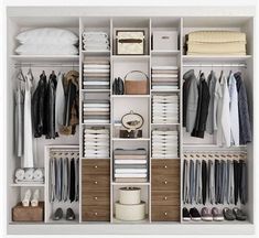 an organized closet with clothes and shoes