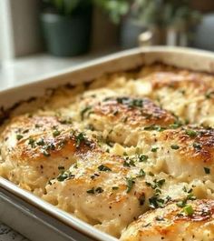 a casserole dish with chicken and cheese