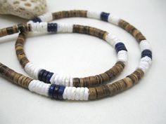 Check out this item in my Etsy shop https://www.etsy.com/listing/553120126/mens-necklace-blue-lapis-lazuli-surf Surfer Design, Surf Necklace, Hawaiian Necklace, Style Surf, Surfer Style, Surfer Necklace, Deep Royal Blue, Puka Shell, Blue Lapis Lazuli