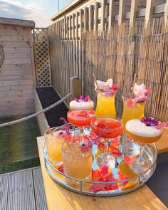 a tray with drinks on top of a wooden table