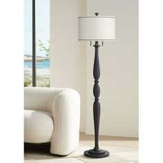 a living room scene with focus on the floor lamp