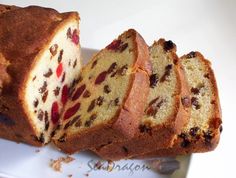 a loaf of fruit bread cut into slices