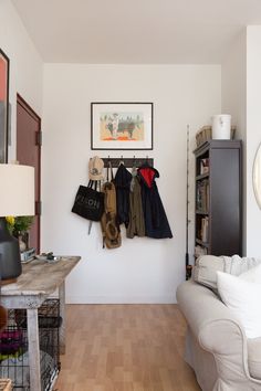 a living room filled with furniture and a wooden floor