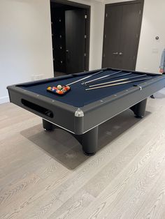 a pool table in the middle of a room